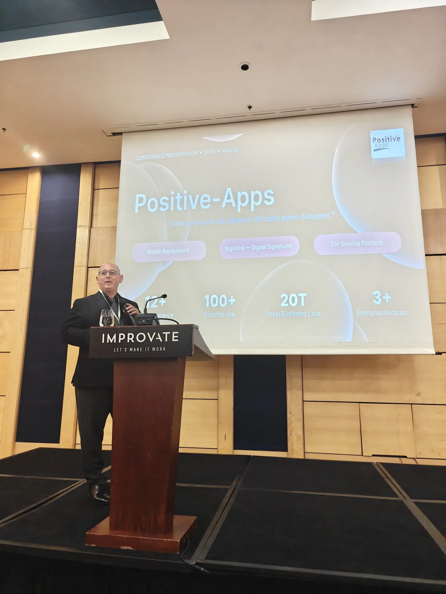 Ami Halfon presenting Positive-Apps and SignOnX on stage at the Albania Cyber Summit